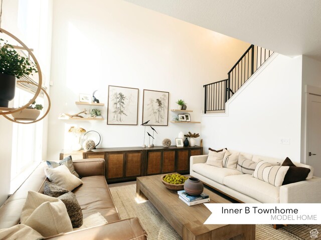 living room with a high ceiling