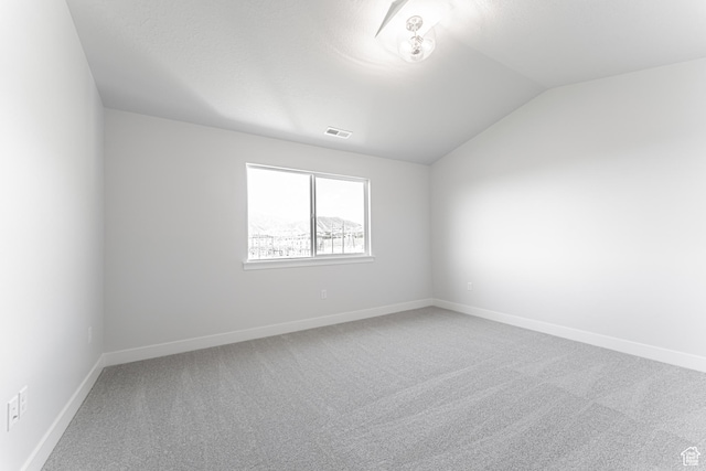 702 W 4500 S Unit 308, Mapleton, UT 84664 - carpeted spare room featuring lofted ceiling and baseboards