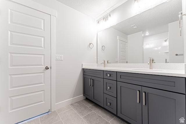 702 W 4500 S Unit 308, Mapleton, UT 84664 - bathroom with double vanity, tile patterned flooring, and baseboards