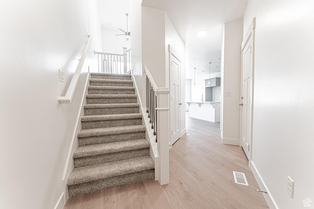 698 W 4500 S Unit 309, Mapleton, UT 84664 - stairs featuring a ceiling fan, wood finished floors, and baseboards