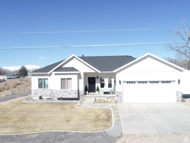 284 W 270 N, Moroni, UT 84646 - view of front of home with an attached garage, stone siding, concrete driveway, and roof with shingles