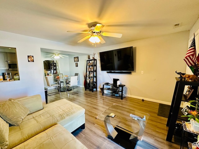4110 S Oak Meadows Dr Unit 20, Taylorsville, UT 84123 - living room featuring wood finished floors, a ceiling fan, and baseboards