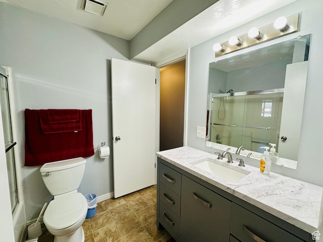 4110 S Oak Meadows Dr Unit 20, Taylorsville, UT 84123 - full bathroom with baseboards, visible vents, toilet, a shower with door, and vanity