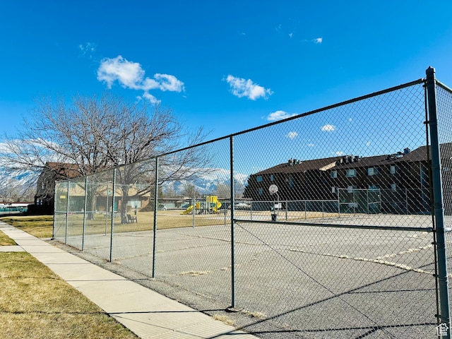 4110 S Oak Meadows Dr Unit 20, Taylorsville, UT 84123 - view of tennis court with fence and playground community