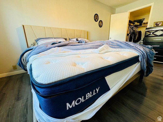 4110 S Oak Meadows Dr Unit 20, Taylorsville, UT 84123 - bedroom with a spacious closet, a closet, wood finished floors, and baseboards