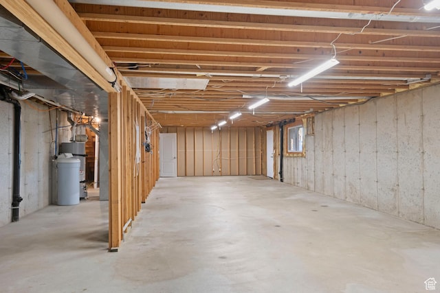 unfinished below grade area with strapped water heater