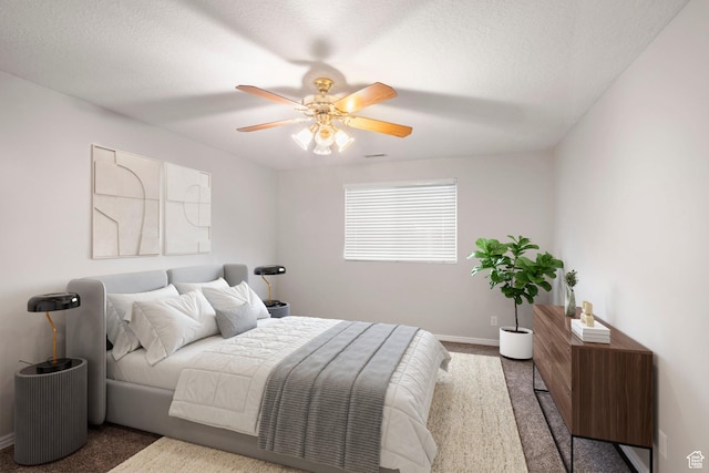 bedroom with carpet floors, a ceiling fan, and baseboards