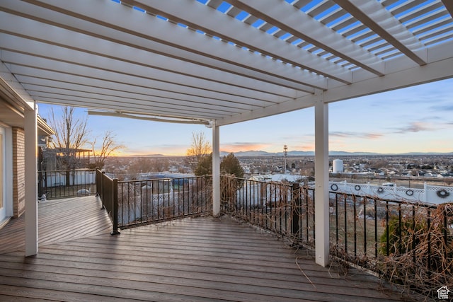 deck at dusk with a pergola