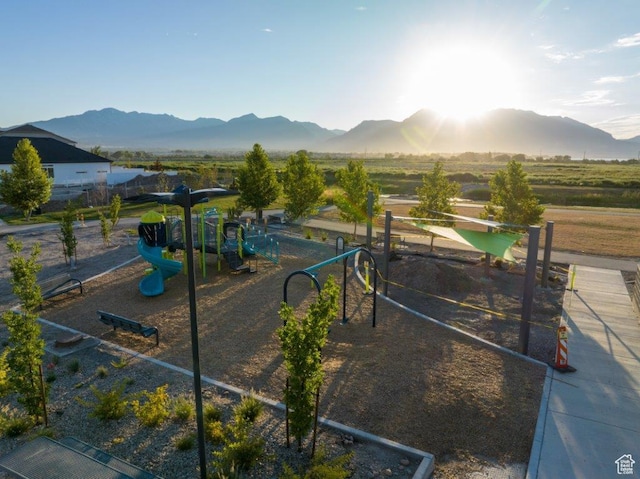 community jungle gym featuring a mountain view