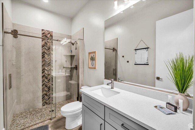 5159 W 2200 S, Hurricane, UT 84737 - bathroom featuring toilet, a stall shower, and vanity