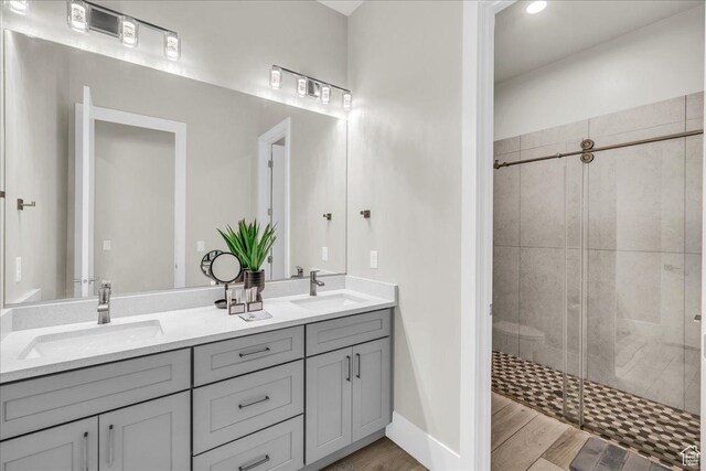 5159 W 2200 S, Hurricane, UT 84737 - full bath with double vanity, a sink, a shower stall, and wood finished floors