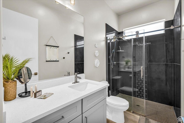 5159 W 2200 S, Hurricane, UT 84737 - full bathroom with toilet, a shower stall, wood finished floors, and vanity