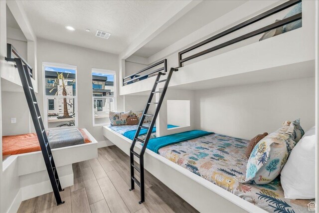 5159 W 2200 S, Hurricane, UT 84737 - bedroom featuring a textured ceiling, visible vents, wood finished floors, and recessed lighting