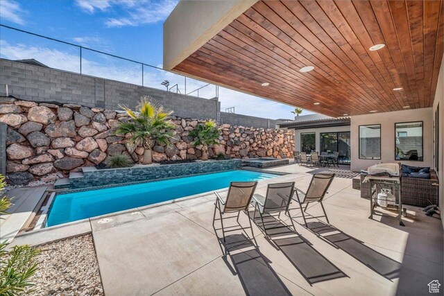 5159 W 2200 S, Hurricane, UT 84737 - pool featuring a fenced backyard, an outdoor living space, a patio, and an in ground hot tub