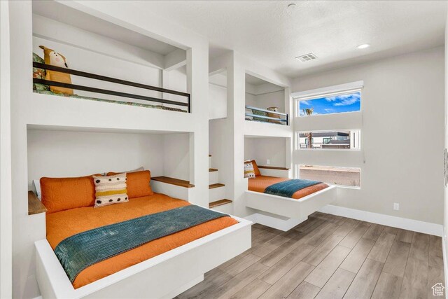 5159 W 2200 S, Hurricane, UT 84737 - bedroom featuring recessed lighting, visible vents, baseboards, and wood finished floors