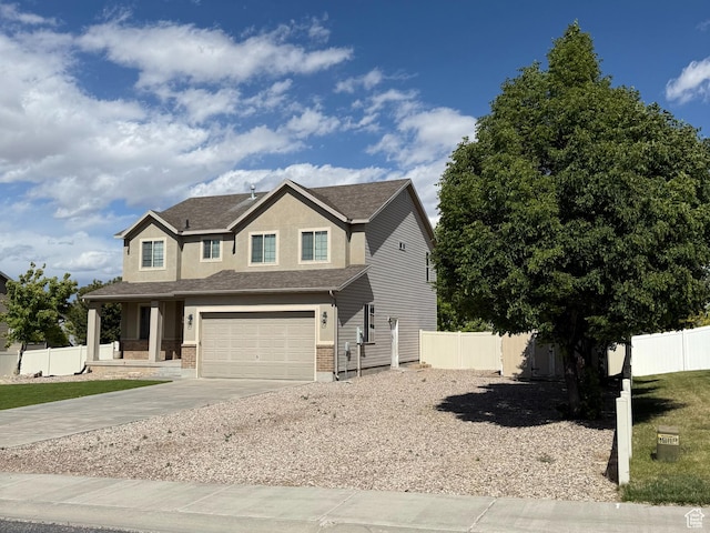 2825 S 400 W, Vernal, UT 84078 - view of front of property with driveway, a shingled roof, a garage, a porch, and stucco siding