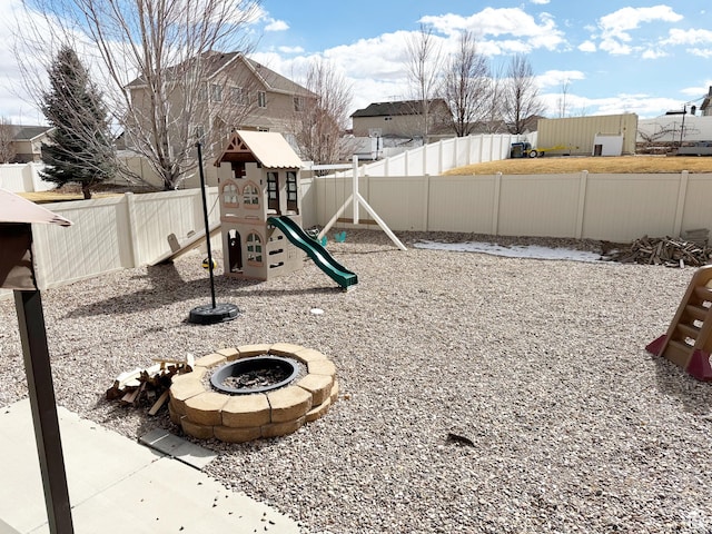 2825 S 400 W, Vernal, UT 84078 - view of play area featuring an outdoor fire pit, a fenced backyard, and a residential view