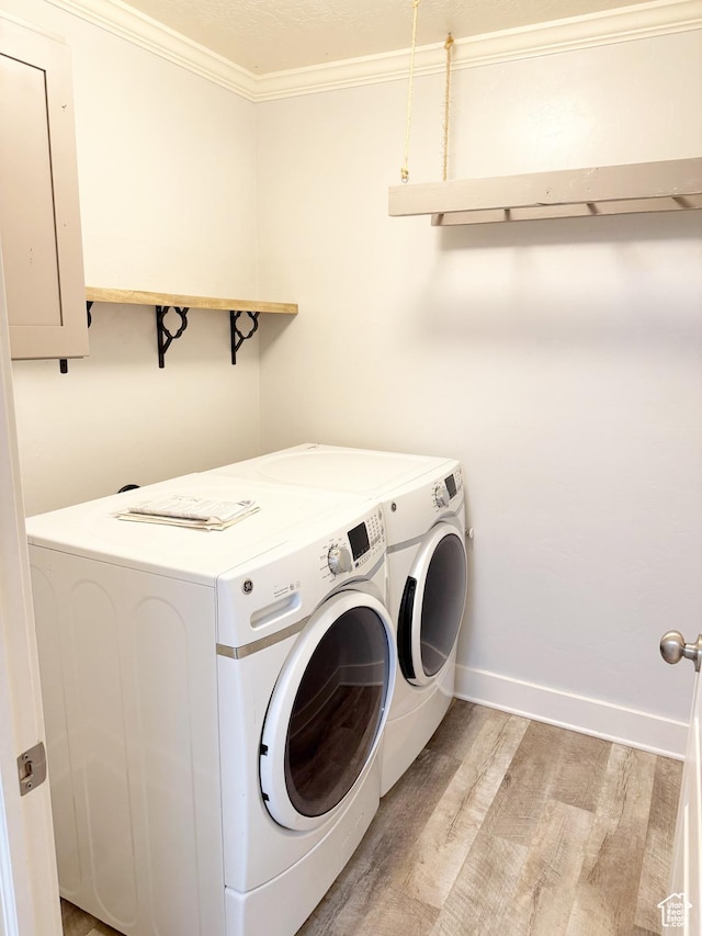 2825 S 400 W, Vernal, UT 84078 - washroom featuring washer and dryer, light wood-style floors, ornamental molding, and baseboards