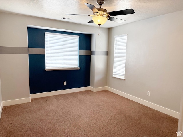 2825 S 400 W, Vernal, UT 84078 - unfurnished room with light colored carpet, ceiling fan, a textured ceiling, and baseboards