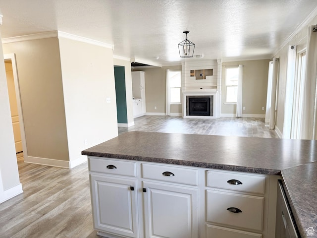 2825 S 400 W, Vernal, UT 84078 - kitchen with dark countertops, light wood finished floors, open floor plan, white cabinetry, and a textured ceiling