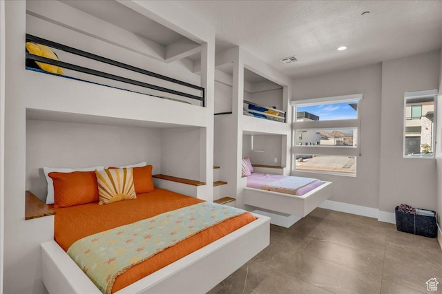 bedroom with recessed lighting, visible vents, and baseboards