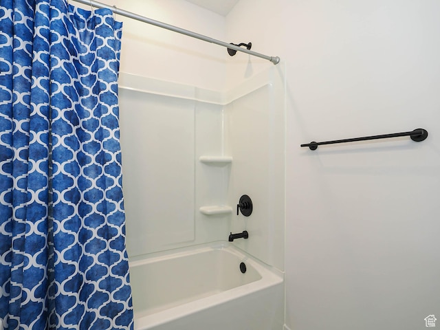 bathroom featuring shower / bathtub combination with curtain