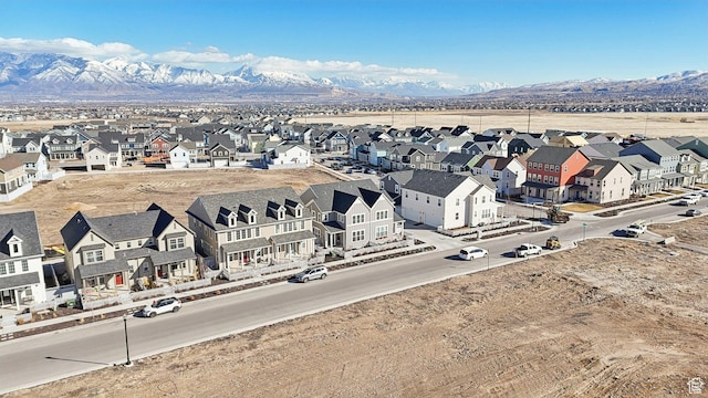 drone / aerial view featuring a residential view and a mountain view