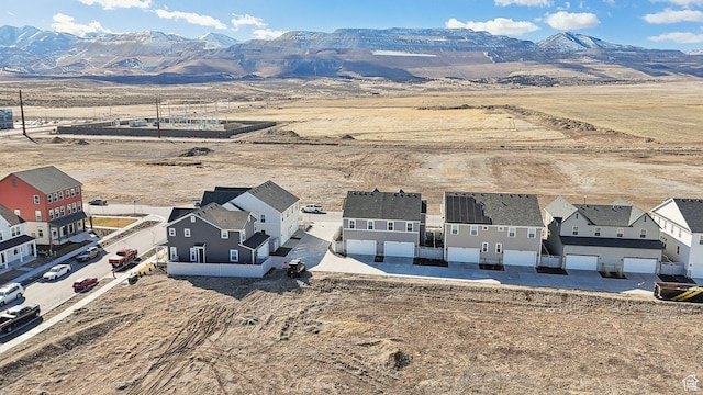 drone / aerial view featuring a residential view and a mountain view