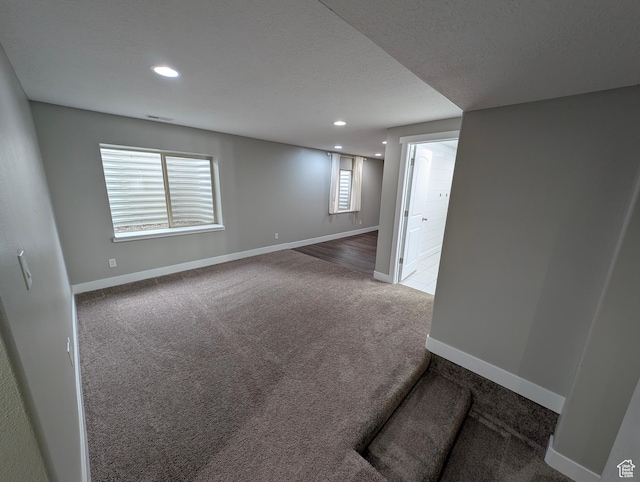 carpeted spare room with baseboards and recessed lighting