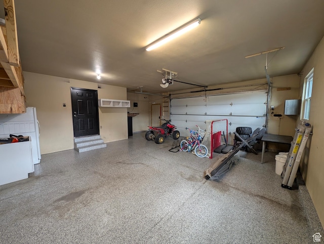 garage featuring a garage door opener