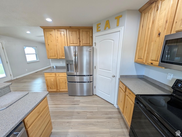 kitchen featuring stainless steel appliances, recessed lighting, light brown cabinets, light wood-style floors, and light countertops