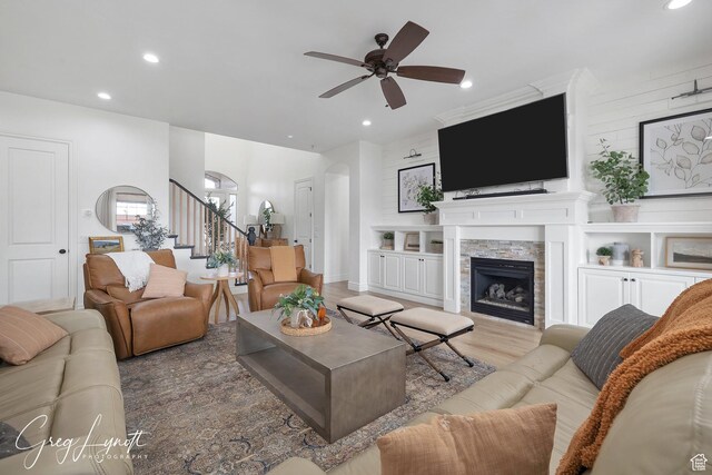 395 W Granite Dr, Washington, UT 84780 - living area with stairway, recessed lighting, a ceiling fan, a stone fireplace, and wood finished floors