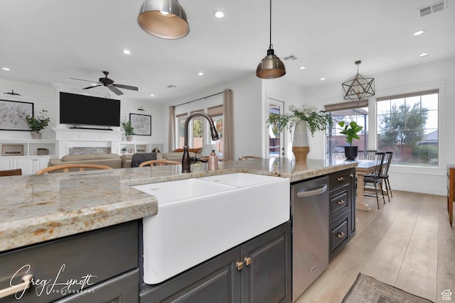 395 W Granite Dr, Washington, UT 84780 - kitchen with a sink, a ceiling fan, pendant lighting, recessed lighting, and a fireplace