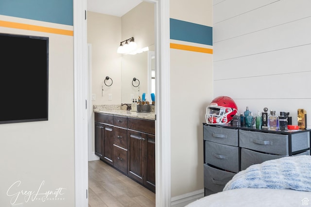 395 W Granite Dr, Washington, UT 84780 - bathroom featuring wood finished floors, vanity, and baseboards