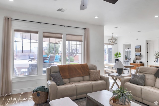 395 W Granite Dr, Washington, UT 84780 - living room featuring healthy amount of natural light, ceiling fan, wood finished floors, recessed lighting, and baseboards