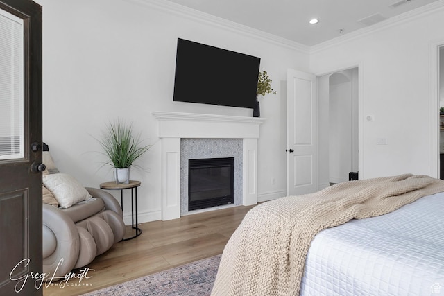 395 W Granite Dr, Washington, UT 84780 - bedroom featuring wood finished floors, recessed lighting, crown molding, baseboards, and a fireplace
