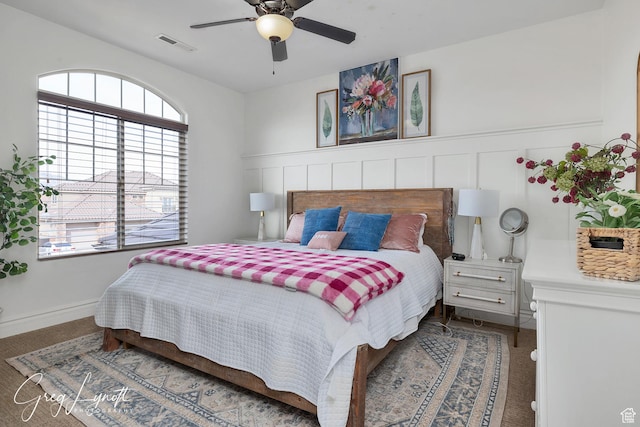 395 W Granite Dr, Washington, UT 84780 - bedroom with wainscoting, ceiling fan, and carpet