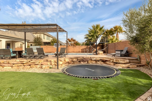 395 W Granite Dr, Washington, UT 84780 - view of yard with a trampoline, a patio area, a pool, and an outdoor fire pit