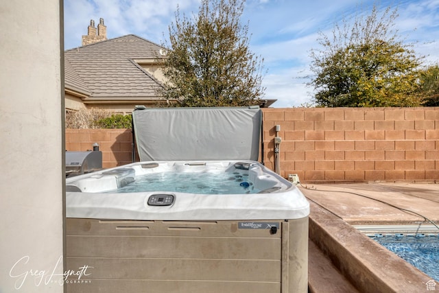 395 W Granite Dr, Washington, UT 84780 - view of patio with fence and a hot tub