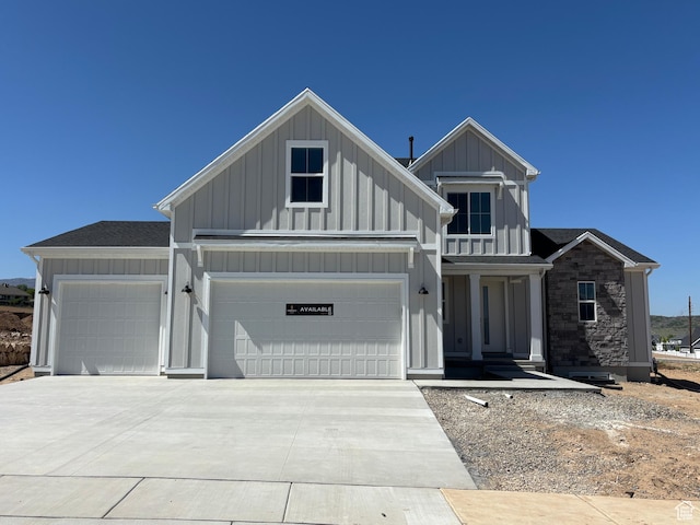 1678 S 130 W Unit 48, Salem, UT 84653 - view of front of property featuring board and batten siding, a garage, and concrete driveway