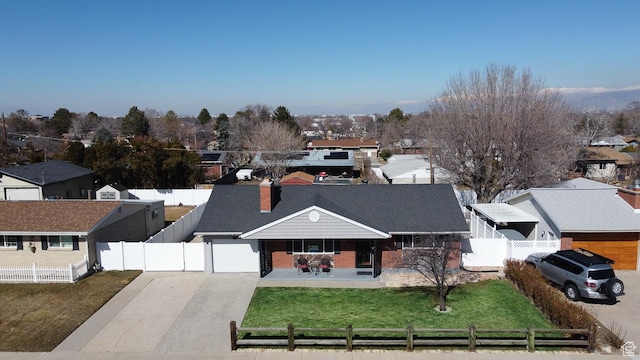 3664 W 3965 S, West Valley City, UT 84120 - ranch-style house featuring a fenced front yard, a residential view, driveway, and a front lawn