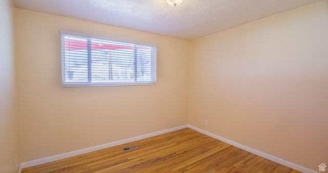 3664 W 3965 S, West Valley City, UT 84120 - unfurnished room featuring visible vents, light wood-style flooring, and baseboards