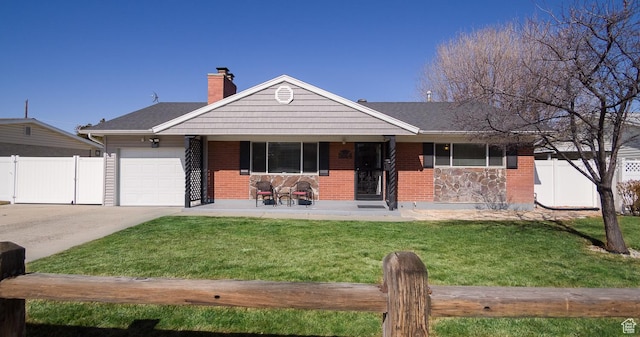 ranch-style home with a garage, concrete driveway, a front lawn, and fence