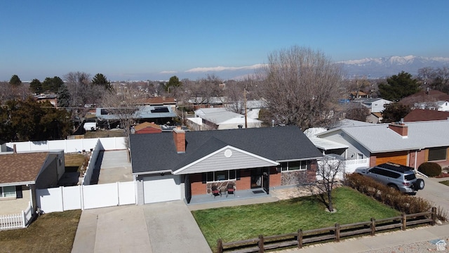 3664 W 3965 S, West Valley City, UT 84120 - ranch-style house with fence private yard, concrete driveway, a residential view, a chimney, and a front yard