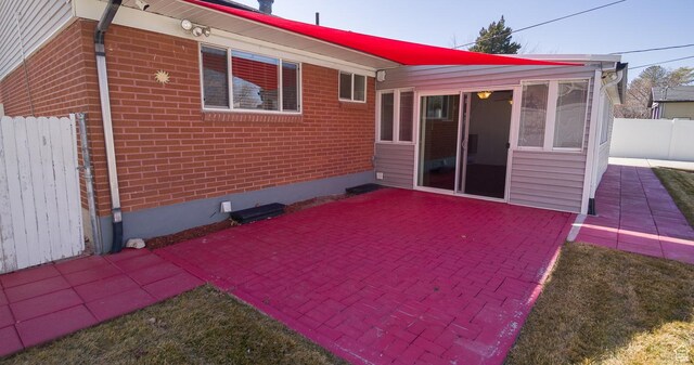 3664 W 3965 S, West Valley City, UT 84120 - exterior space featuring a patio, brick siding, and fence