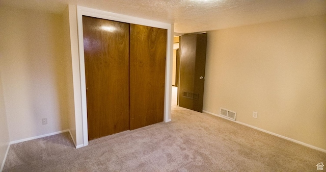 3664 W 3965 S, West Valley City, UT 84120 - unfurnished bedroom featuring carpet, a closet, visible vents, and a textured ceiling
