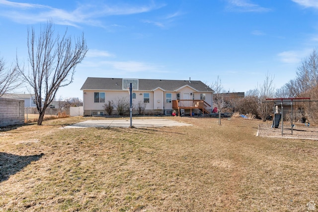back of house with a yard, a patio, a deck, and fence