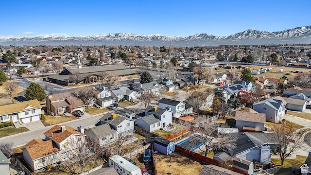 bird's eye view with a residential view and a mountain view