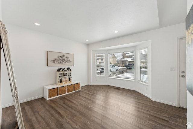 interior space with dark wood-style floors, baseboards, and recessed lighting