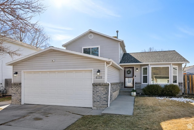 view of front of home featuring a garage, driveway, brick siding, and roof with shingles